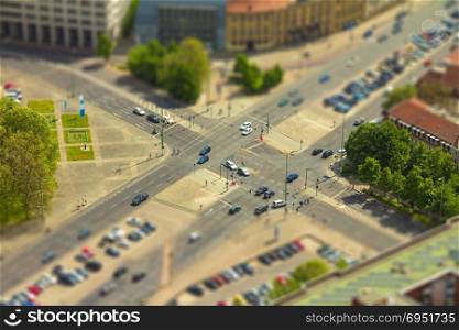 Aerial view of cars in a road junction in a street of Berlin city. with tilt-shift effect.
