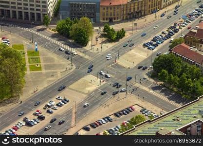 Aerial view of cars in a road junction in a street of Berlin city.