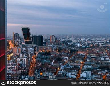 Aerial view of Castellana and Madrid&rsquo;s skyline at dawn, with the twin leaning modern office blocks (Puerta de Europa) in Plaza de Castilla to be recognised in the foreground.