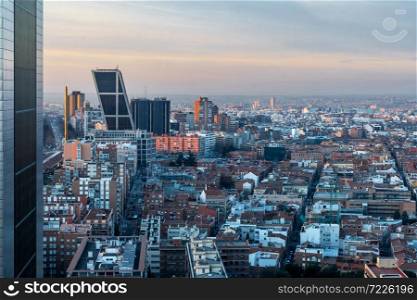 Aerial view of Castellana and Madrid&rsquo;s skyline at dawn, with the twin leaning modern office blocks (Puerta de Europa) in Plaza de Castilla to be recognised in the foreground.