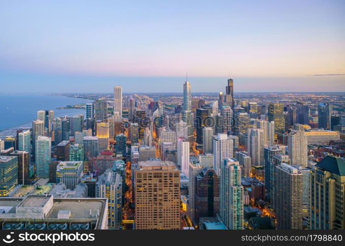 Aerial view of Chicago downtown skyline at sunset from high above.