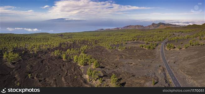 Aerial view of Chinyero Forest with ocean and La Palma Island in the back, Tenerife, Canary Islands, Spain