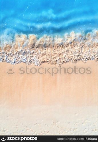 Aerial view of clear blue sea with waves and empty white sandy beach at sunset. Summer in Zanzibar, Africa. Tropical landscape with white sand and azure water. Ocean. Top view. Nature background