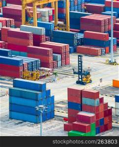 Aerial view of commercial port with colorful freight containers and equipment, Singapore