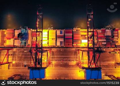 Aerial view of Container port terminal at twilight in Hong Kong.