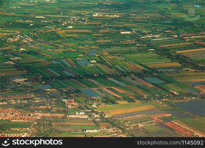 Aerial view of countryside area and green rice fields in beside Chao Phraya river.