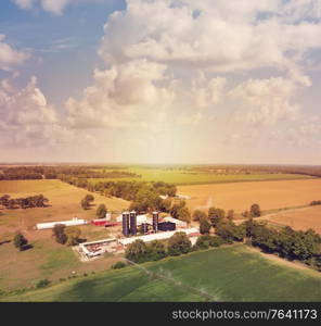 Aerial view of countryside with farm buildings and fields.Summer landscape at sunset.