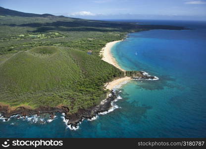 Aerial view of crater on Maui, Hawaii coast with beach.