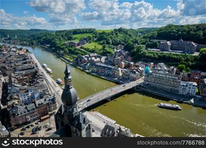 Aerial view of Dinant town, Collegiate Church of Notre Dame de Dinant, River Meuse and Pont Charles de Gaulle bridge from Dinant Citadel. Dinant, Belgium. Aerial view of Dinant town, Belgium