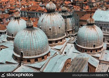 Aerial view of Domed Roof of Saint Marks Cathedral and Houses in Venice, Italy