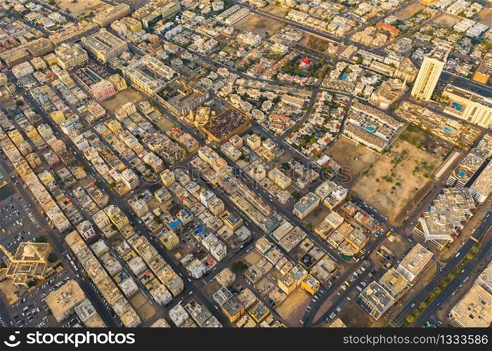 Aerial view of Dubai Downtown skyline, United Arab Emirates or UAE. Financial district and business area in smart urban city. Skyscraper and high-rise buildings at sunset.
