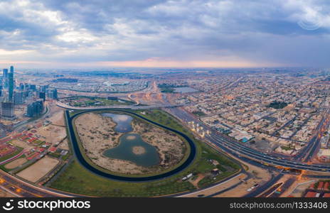 Aerial view of Dubai Downtown skyline, urban city in United Arab Emirates or UAE. Apartments and residential district in urban city. Buildings at sunset. Architecture landscape background.