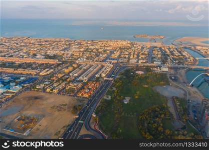 Aerial view of Dubai Downtown skyline, urban city in United Arab Emirates or UAE. Apartments and residential district in urban city. Buildings at sunset. Architecture landscape background.