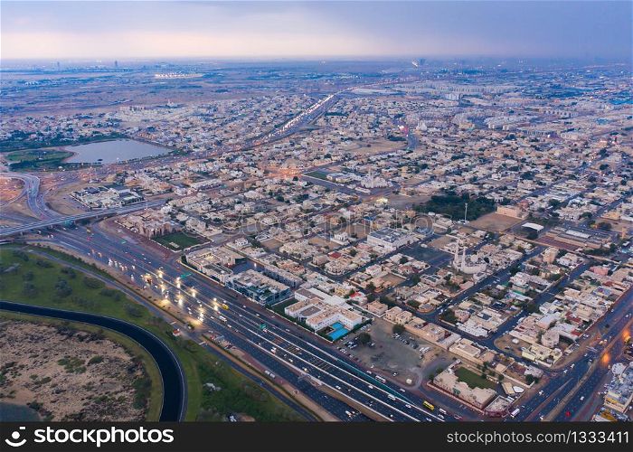 Aerial view of Dubai Downtown skyline, urban city in United Arab Emirates or UAE. Apartments and residential district in urban city. Buildings at sunset. Architecture landscape background.