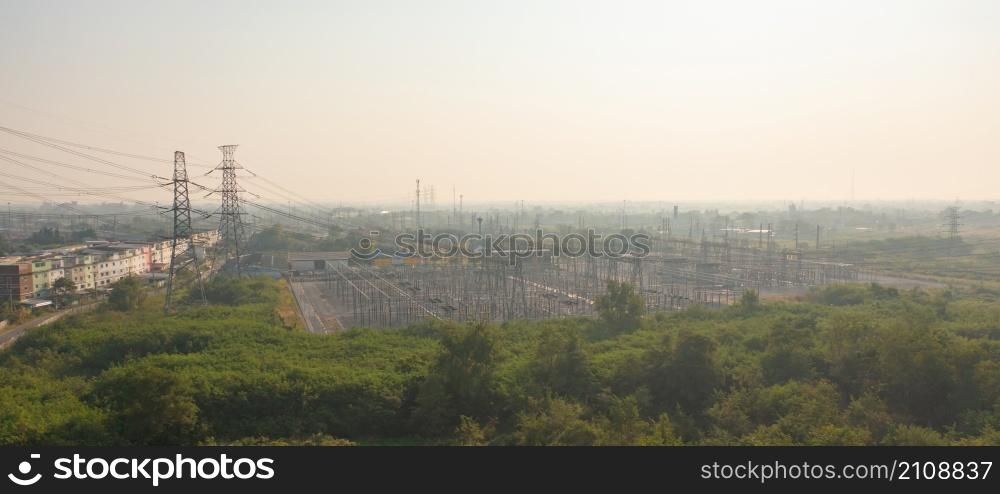 Aerial view of electricity generating, voltage poles. Power lines on utility tower and cable wires in energy electric technology, network, and industry. Generator pylon. Transmission and substation.