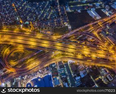 Aerial view of expressway and motorway at night shot by drone in Bangkok, Thailand.