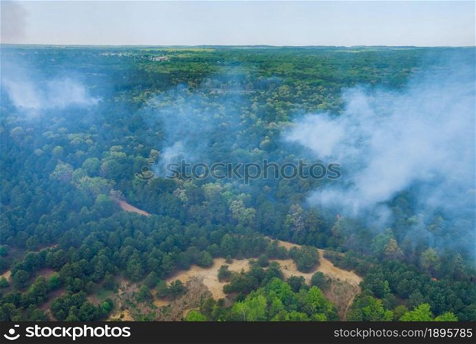 Aerial view of forest fire in spring fire in the trees dry grass in the forest.. Aerial view of forest fire in spring fire in the forest