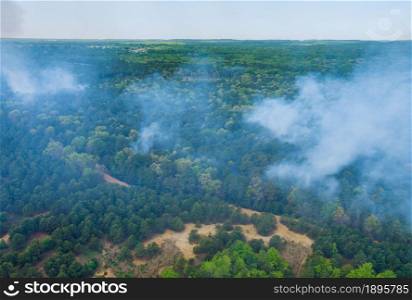 Aerial view of forest fire in spring fire in the trees dry grass in the forest.. Aerial view of forest fire in spring fire in the forest