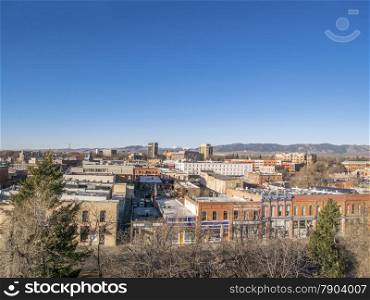 aerial view of Fort Collins downtown in sunrise light, shot from a low flying drone, early spring scenery under clear, blue sky