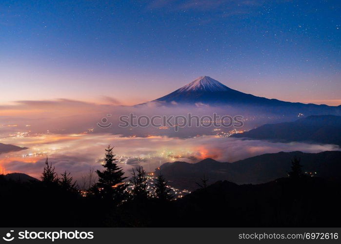 Aerial view of Fuji mountain with mist or fog at sunrise in Fujikawaguchiko, Yamanashi. Fuji five lakes, Japan. Landscape with hills