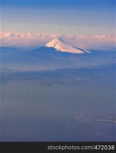 Aerial view of Fuji san, Mountain Fuji, landmark mountain of Japan. Take from Airplane while fly pass Fuji City Shizuoka Japan,