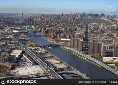 Aerial view of Harlem River and bridges with the Bronx and Manhattan buildings in New York City.