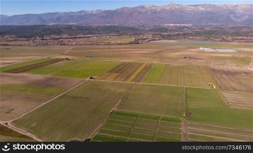 Aerial view of harvest fields under the blue sky