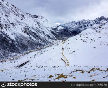 Aerial view of highway at the snow mountain in Sichuan, China