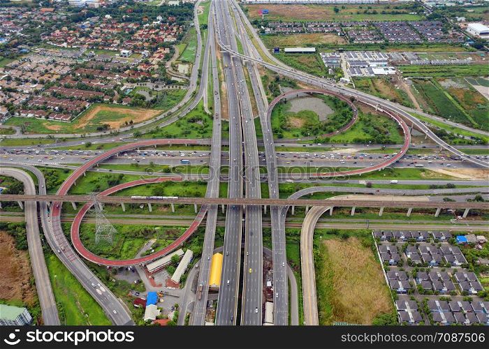 Aerial view of highway junctions. Bridge roads shape number 8 or infinity sign in structure of architecture concept. Top view. Urban city, Bangkok, Thailand.