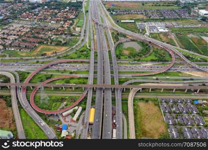 Aerial view of highway junctions. Bridge roads shape number 8 or infinity sign in structure of architecture concept. Top view. Urban city, Bangkok, Thailand.