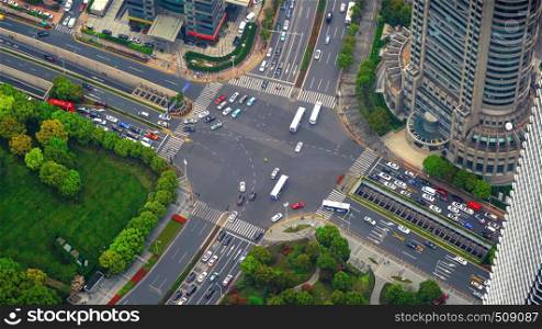 Aerial view of highway junctions shape letter x cross. Bridges, roads, or streets in transportation concept. Structure shapes of architecture in urban city, Shanghai Downtown, China
