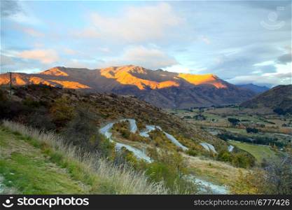 Aerial view of Highway Road Freeway to Arrow Town with Sunrise Mountain range Landscape New Zealand