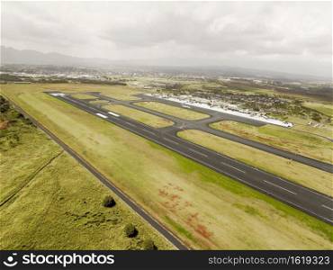 Aerial View Of Hilo International Airport Runway, Hawaii With Cloudy Sky