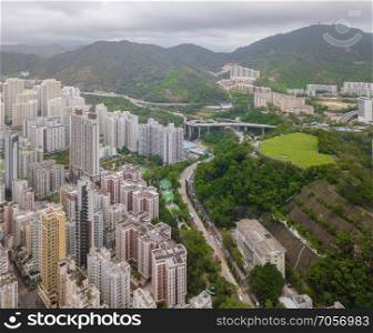 Aerial view of Hong Kong apartments in cityscape background, Sham Shui Po District. Residential district in smart city in Asia. Top view of buildings.