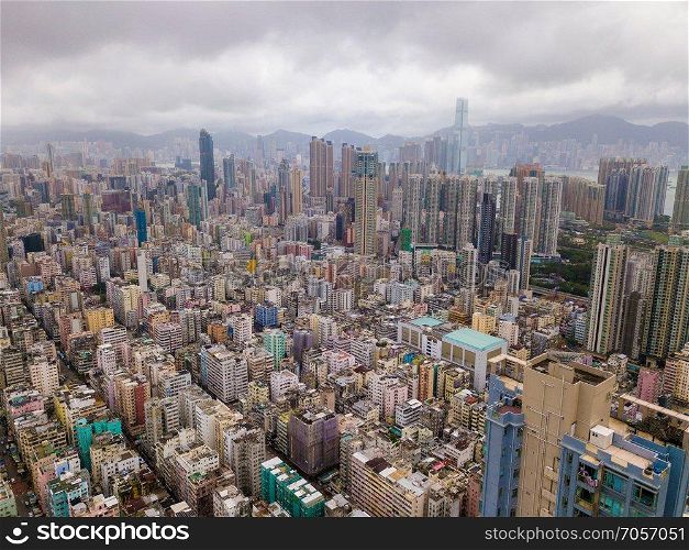 Aerial view of Hong Kong apartments in cityscape background, Sham Shui Po District. Residential district in smart city in Asia. Top view of buildings.