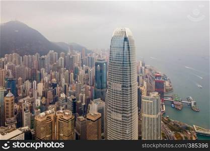 Aerial view of Hong Kong Downtown. Financial district and business centers in smart city and technology concept. skyscraper and high-rise buildings at sunset. Top view of tower