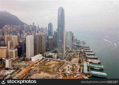Aerial view of Hong Kong Downtown. Financial district and business centers in smart city and technology concept. skyscraper and high-rise buildings at sunset. Top view of tower