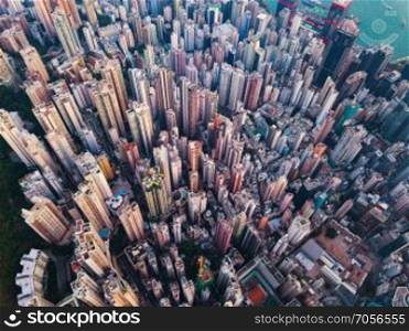 Aerial view of Hong Kong Downtown. Financial district and business centers in smart city in Asia. Top view of skyscraper and high-rise buildings.
