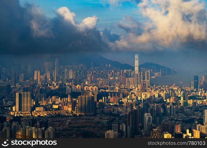 Aerial view of Hong Kong Downtown, Republic of China. Financial district and business centers in technology smart city in Asia. Top view of skyscraper and high-rise buildings at sunset.