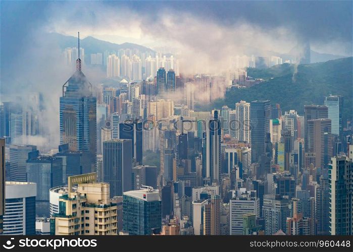 Aerial view of Hong Kong Downtown, republic of china. Financial district and business centers in smart urban city in Asia. Skyscraper and high-rise buildings at sunset.