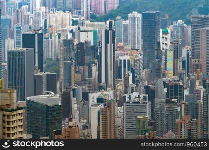 Aerial view of Hong Kong Downtown, republic of china. Financial district and business centers in smart urban city in Asia. Skyscraper and high-rise buildings at sunset.