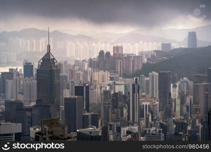 Aerial view of Hong Kong Downtown, republic of china. Financial district and business centers in smart urban city in Asia. Skyscraper and high-rise buildings at sunset.