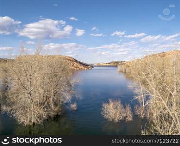aerial view of Horsetooth Reservoir in Fort Collins, Colorado - early spring scenery with high water level and submerged cottonwood trees