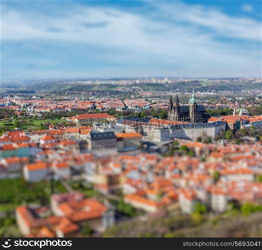 Aerial view of Hradchany part of Prague - the Saint Vitus St. Vitt&#39;s Cathedral and Prague Castle, view from Petrin Observation Tower with tilt shift toy effect shallow depth of field. Prague, Czech Republic