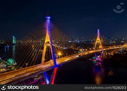 Aerial view of Industry Ring Suspending bridge at night in Bangkok, Thailand.