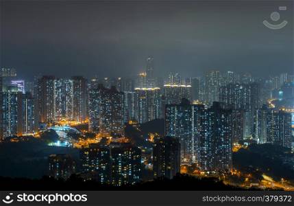 Aerial view of intersection in Sham Shui Po, Shek Kip Mei, Hong Kong Downtown. Financial district and business centers in smart city, technology concept. Top view of buildings at night.