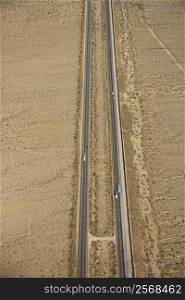 Aerial view of interstate through desert landscape.