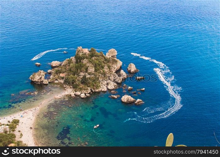 Aerial view of island and Isola Bella beach and blue ocean water in Taormina, Sicily, Italy