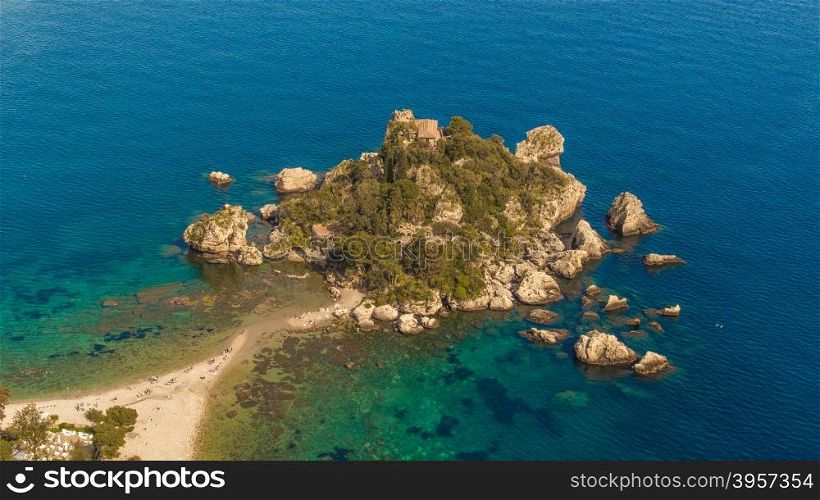 Aerial view of Isola Bella&rsquo;s island and beach on blue ocean water in Taormina - Sicily.