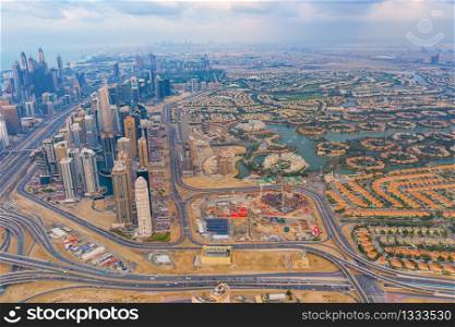 Aerial view of Jumeirah island, Dubai Downtown skyline in United Arab Emirates or UAE. Financial district and business area in smart urban city. Skyscraper and high-rise buildings.